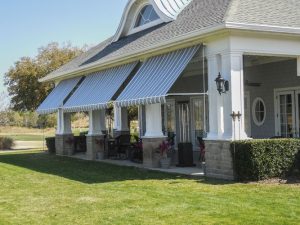 A customer choosing from various awnings in a showroom.